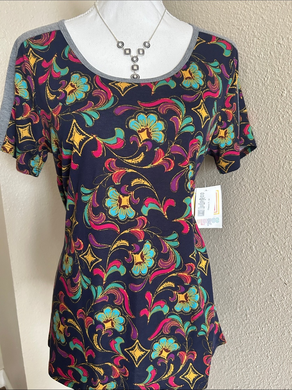 LuLaRoe Black Short Sleeve Scoop Neck Top with Teal Pink Yellow Floral Print